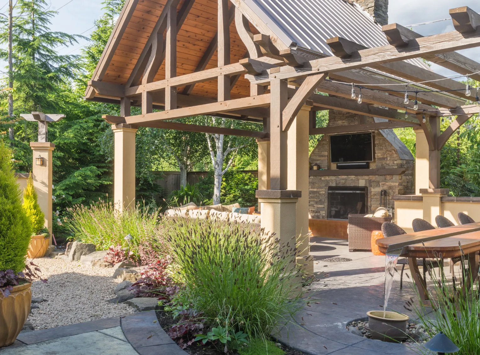Custom patio and pergola design in Los Angeles backyard with modern outdoor seating area