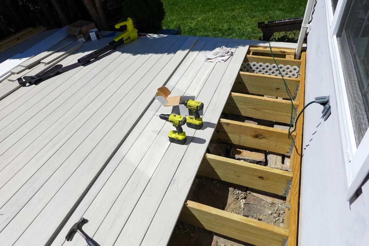 Deck and patio remodeling in Los Angeles showing composite deck installation and structural framing work