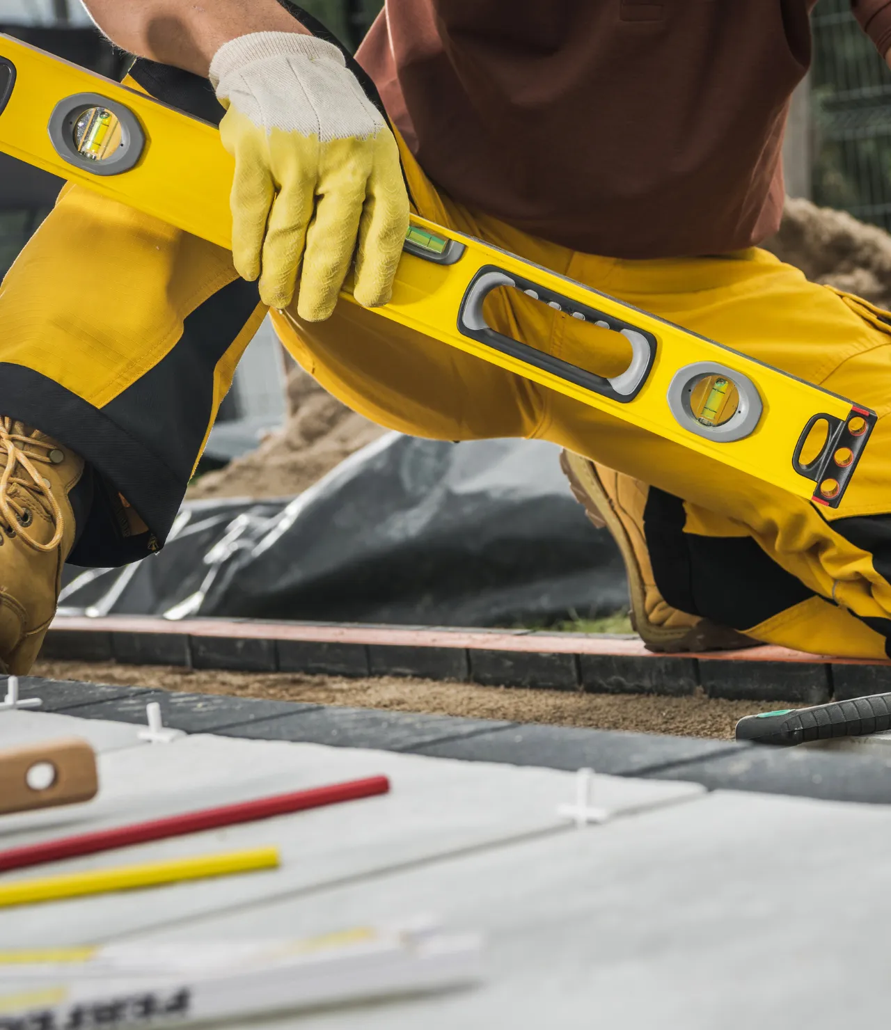 Patio Builders Pro team member working on a patio construction project